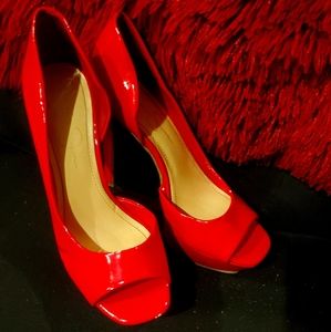 Red platform patten leather heels